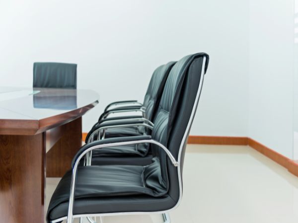 This image is of a boardroom requiring storage furniture.